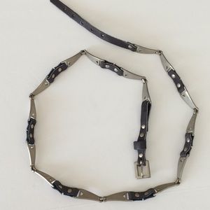 Segmented leather and nickel colored metal skinny
